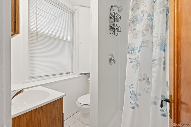 6480 W 60th Ave, Arvada, CO 80003 - bathroom with tile patterned floors, a shower with shower curtain, toilet, and vanity