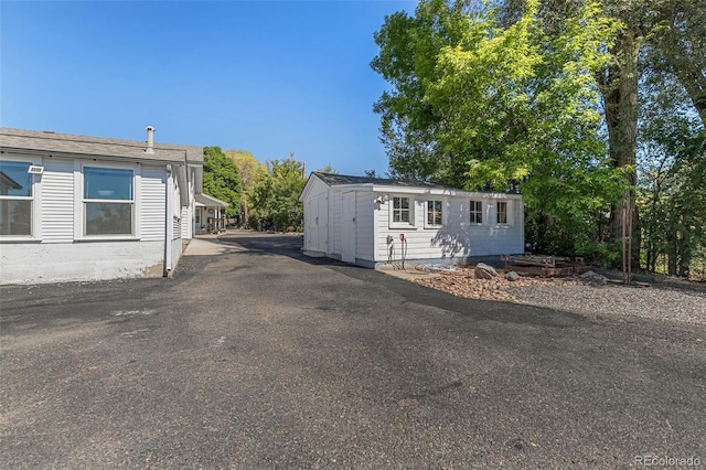 6480 W 60th Ave, Arvada, CO 80003 - view of front of home with a shed and an outdoor structure