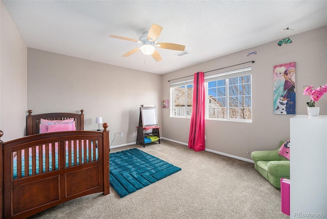 bedroom with visible vents, baseboards, a ceiling fan, and carpet flooring