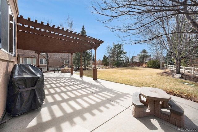 view of patio with fence, a pergola, and a grill