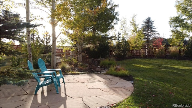 view of patio / terrace featuring fence