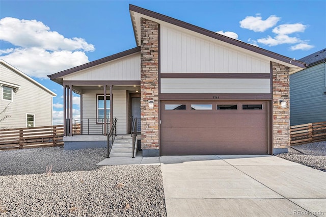 view of front of property featuring covered porch and a garage