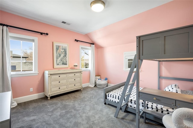 bedroom featuring visible vents, baseboards, vaulted ceiling, and carpet