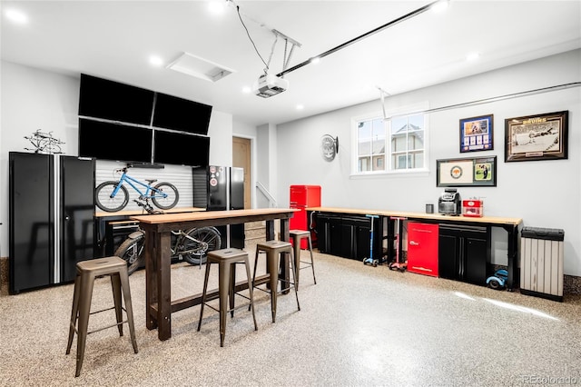 bar featuring recessed lighting and freestanding refrigerator