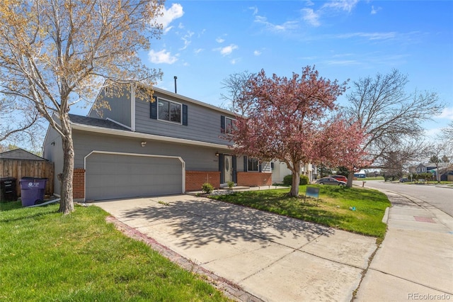 4860 S Field Way, Littleton, CO 80123 - view of front of home with brick siding, a garage, a front lawn, and concrete driveway