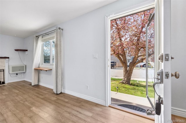 4860 S Field Way, Littleton, CO 80123 - unfurnished living room featuring wood finished floors and baseboards