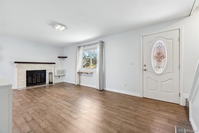 4860 S Field Way, Littleton, CO 80123 - foyer entrance featuring wood finished floors and a fireplace with flush hearth