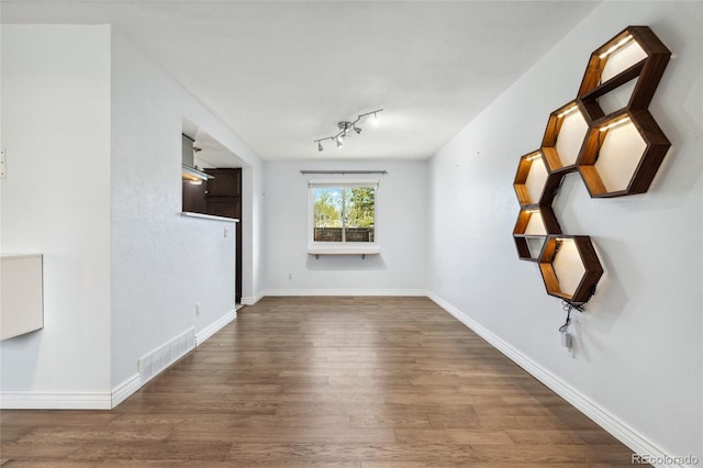 4860 S Field Way, Littleton, CO 80123 - unfurnished living room featuring wood finished floors and baseboards