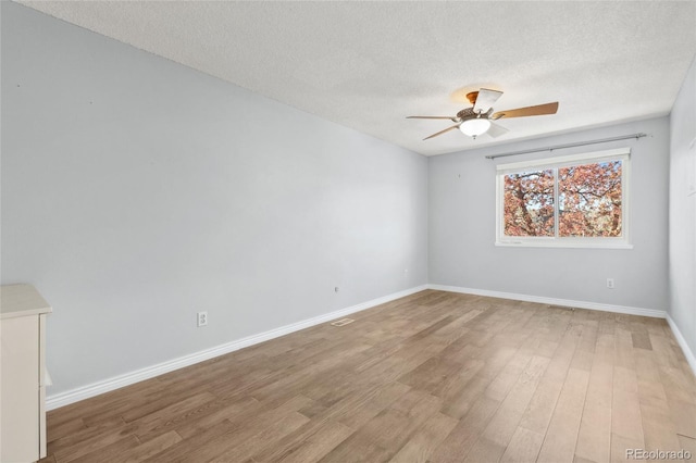 4860 S Field Way, Littleton, CO 80123 - unfurnished room featuring a ceiling fan, wood finished floors, and a textured ceiling