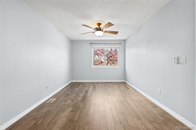 4860 S Field Way, Littleton, CO 80123 - empty room with a ceiling fan, wood finished floors, and a textured ceiling