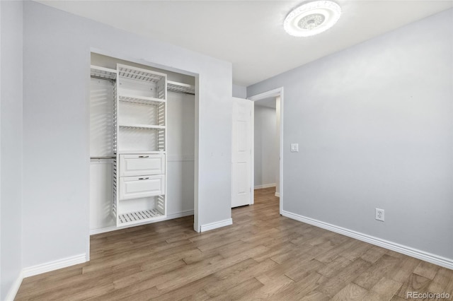 4860 S Field Way, Littleton, CO 80123 - unfurnished bedroom featuring wood finished floors and a closet