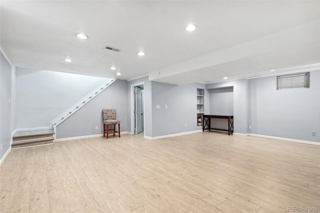 4860 S Field Way, Littleton, CO 80123 - finished basement with stairway, recessed lighting, and light wood-style floors