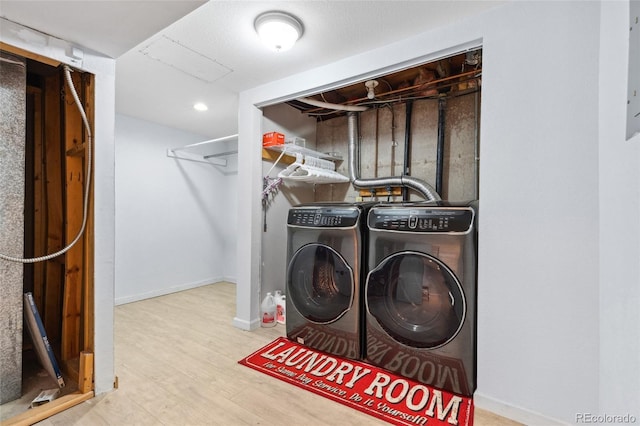4860 S Field Way, Littleton, CO 80123 - laundry area featuring washer and clothes dryer and wood finished floors