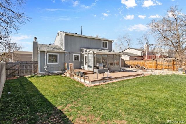 4860 S Field Way, Littleton, CO 80123 - rear view of property with a fenced backyard, a sunroom, a chimney, and a deck