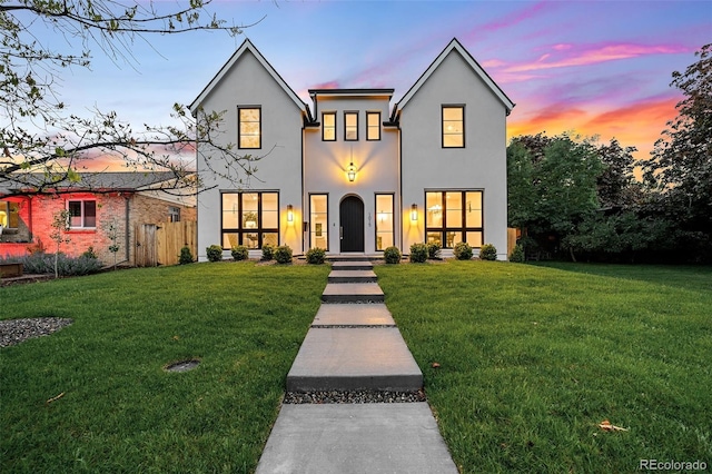 view of front of home with a lawn