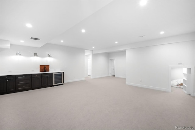 interior space featuring light colored carpet and wine cooler