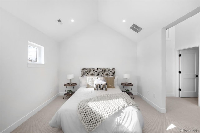 carpeted bedroom featuring lofted ceiling