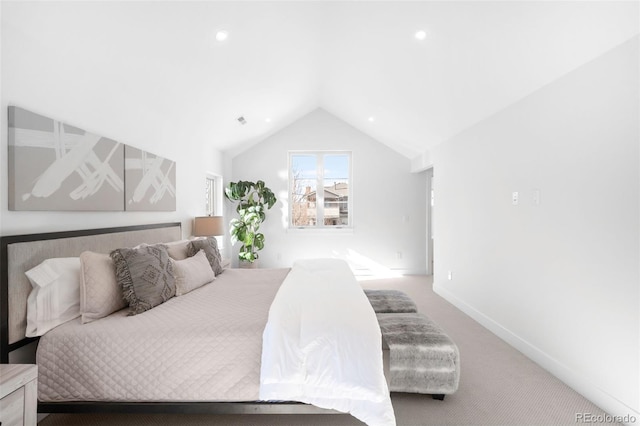 bedroom with carpet flooring and vaulted ceiling