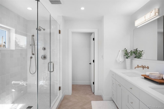 bathroom with vanity and an enclosed shower