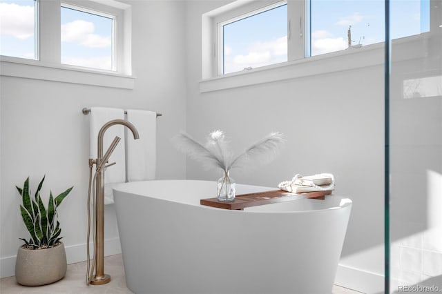 bathroom featuring a tub to relax in