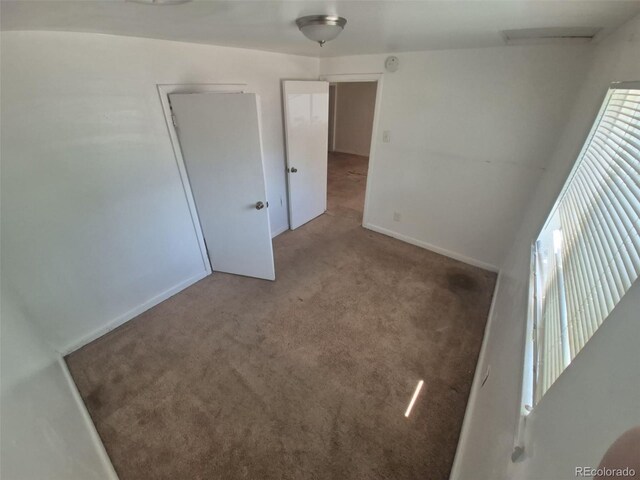 444 S Jersey St, Denver, CO 80224 - carpeted empty room with baseboards