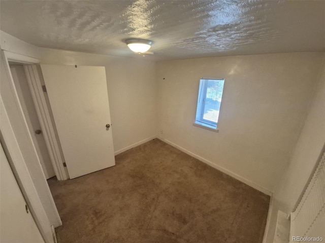 444 S Jersey St, Denver, CO 80224 - carpeted spare room featuring a textured ceiling and baseboards