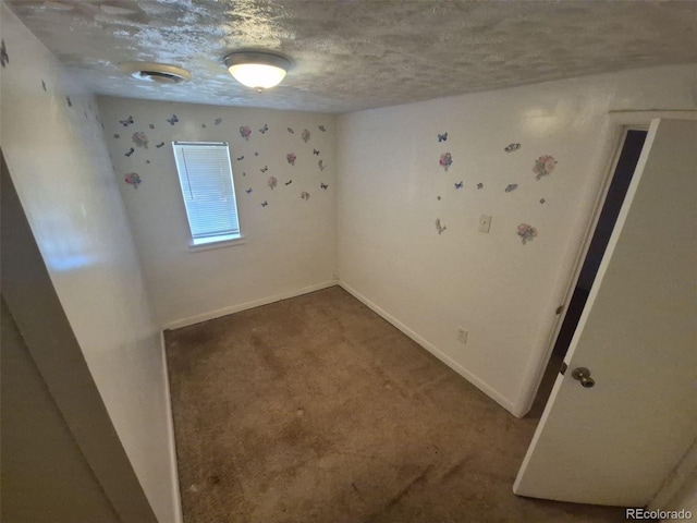 444 S Jersey St, Denver, CO 80224 - empty room with carpet floors, baseboards, and a textured ceiling