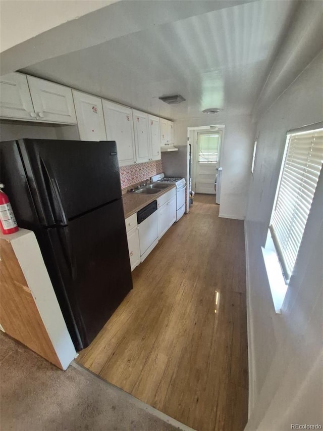 444 S Jersey St, Denver, CO 80224 - kitchen with freestanding refrigerator, dishwasher, white cabinets, tasteful backsplash, and a sink