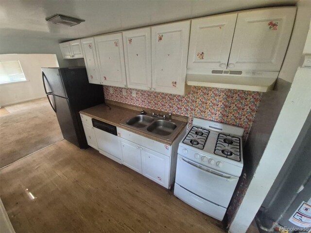 444 S Jersey St, Denver, CO 80224 - kitchen featuring white appliances, under cabinet range hood, a sink, and white cabinetry