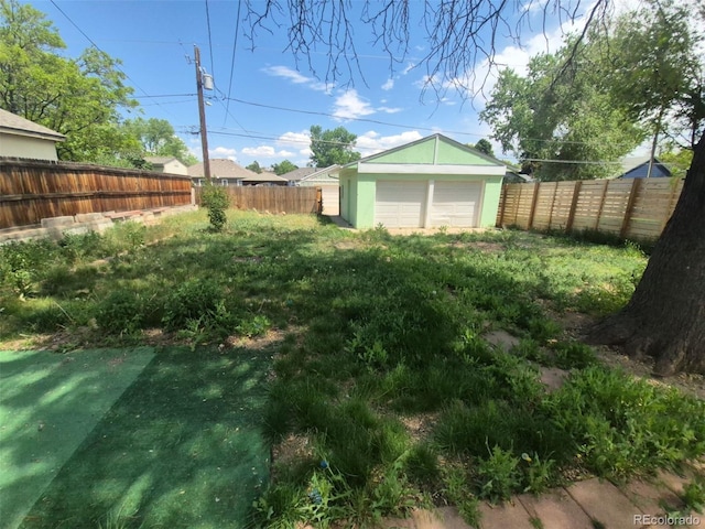 444 S Jersey St, Denver, CO 80224 - fenced backyard with an outdoor structure and a detached garage