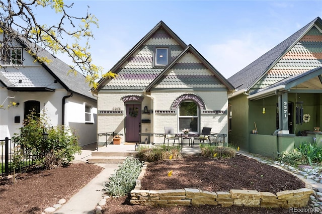 3375 W 37th Ave, Denver, CO 80211 - victorian home with covered porch and brick siding