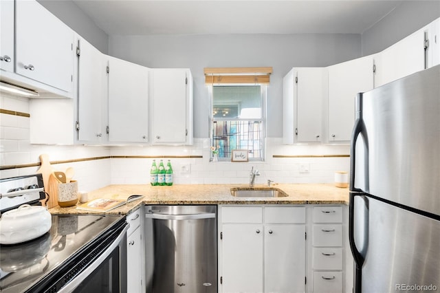 3375 W 37th Ave, Denver, CO 80211 - kitchen with stainless steel appliances, a sink, decorative backsplash, and white cabinets