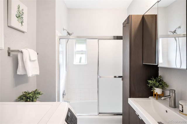 3375 W 37th Ave, Denver, CO 80211 - bathroom with vanity, bath / shower combo with glass door, and washer / dryer