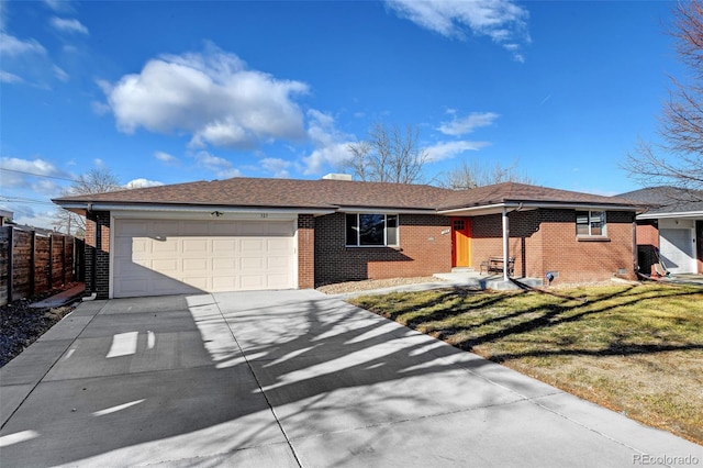 single story home with a garage and a front yard