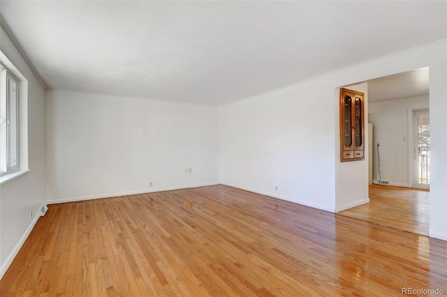 unfurnished room with light hardwood / wood-style flooring