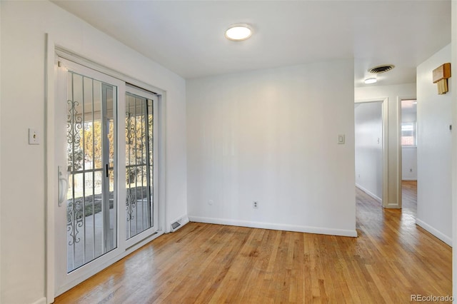 unfurnished room featuring light wood-type flooring