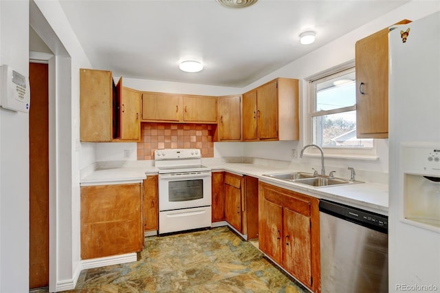 kitchen featuring backsplash, white appliances, and sink