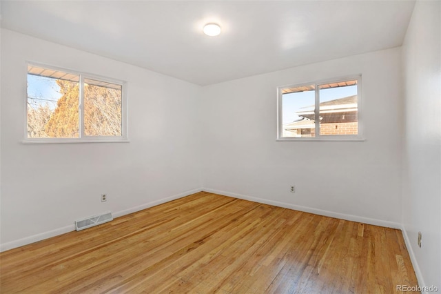 unfurnished room featuring light hardwood / wood-style floors