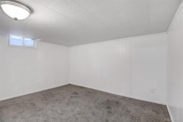 basement featuring dark colored carpet