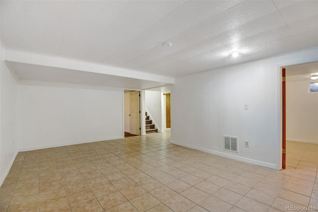 empty room featuring light tile patterned floors