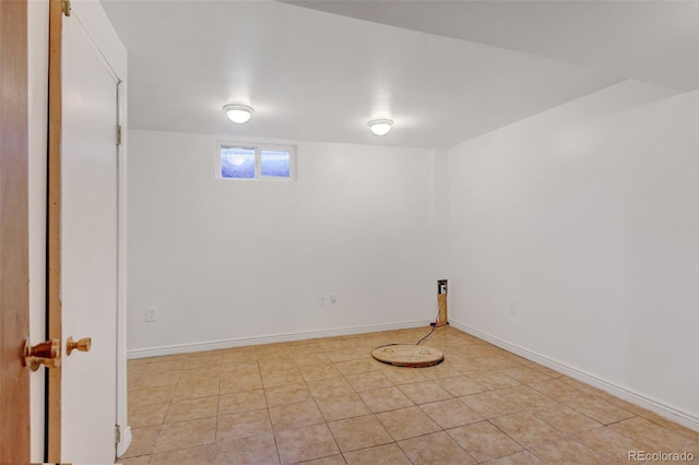 basement featuring light tile patterned flooring