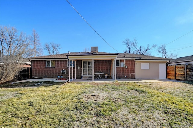 back of house featuring a lawn, a patio area, and central air condition unit