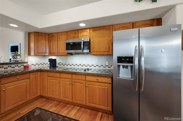 4529 Songglen Cir, Colorado Springs, CO 80906 - kitchen featuring appliances with stainless steel finishes, light wood-type flooring, backsplash, brown cabinets, and recessed lighting