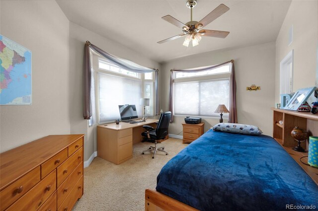 4529 Songglen Cir, Colorado Springs, CO 80906 - bedroom featuring light colored carpet, a desk, baseboards, and a ceiling fan