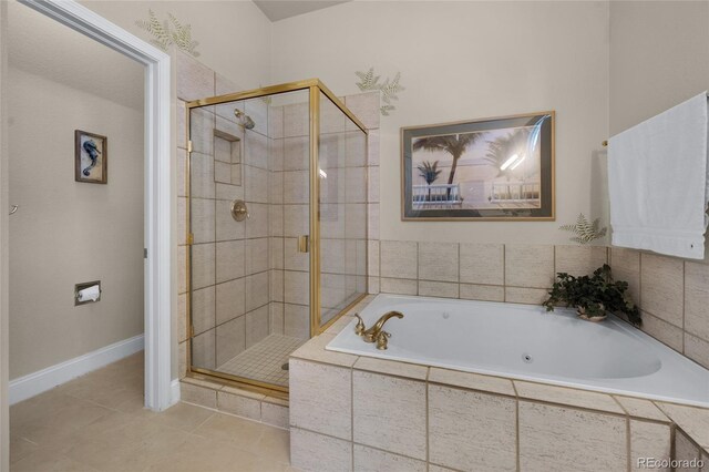 4529 Songglen Cir, Colorado Springs, CO 80906 - bathroom with a whirlpool tub, a shower stall, baseboards, and tile patterned flooring