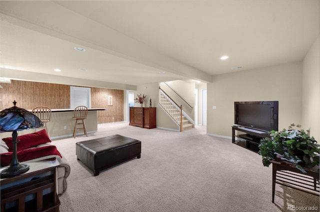 4529 Songglen Cir, Colorado Springs, CO 80906 - living room with stairway, light colored carpet, wooden walls, baseboards, and recessed lighting
