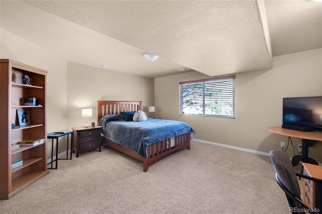 4529 Songglen Cir, Colorado Springs, CO 80906 - bedroom featuring light carpet, a textured ceiling, and baseboards