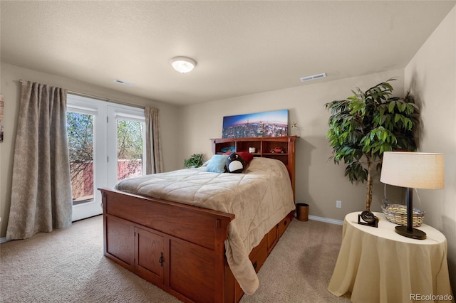 4529 Songglen Cir, Colorado Springs, CO 80906 - bedroom featuring light colored carpet, access to exterior, and baseboards