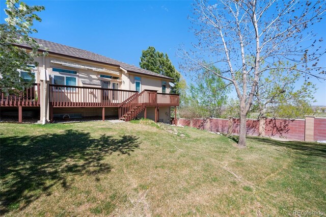 4529 Songglen Cir, Colorado Springs, CO 80906 - rear view of property with a wooden deck, stairway, and a shingled roof