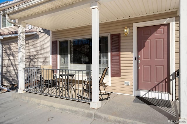 doorway to property with covered porch